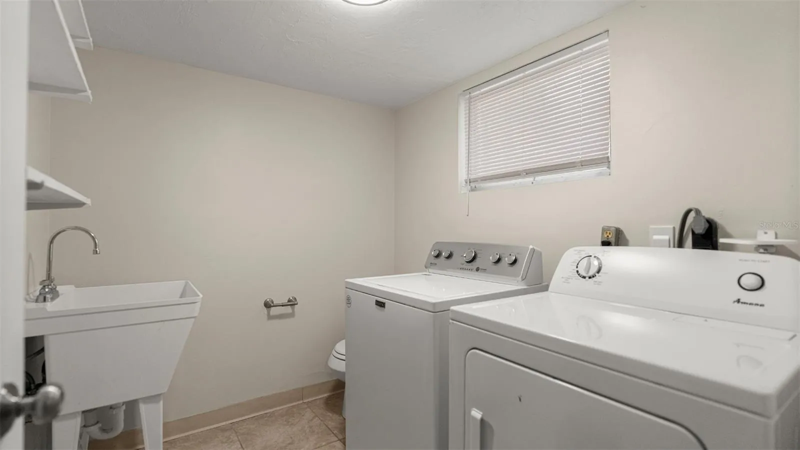 Laundry and half bath off of bottom floor bonus room