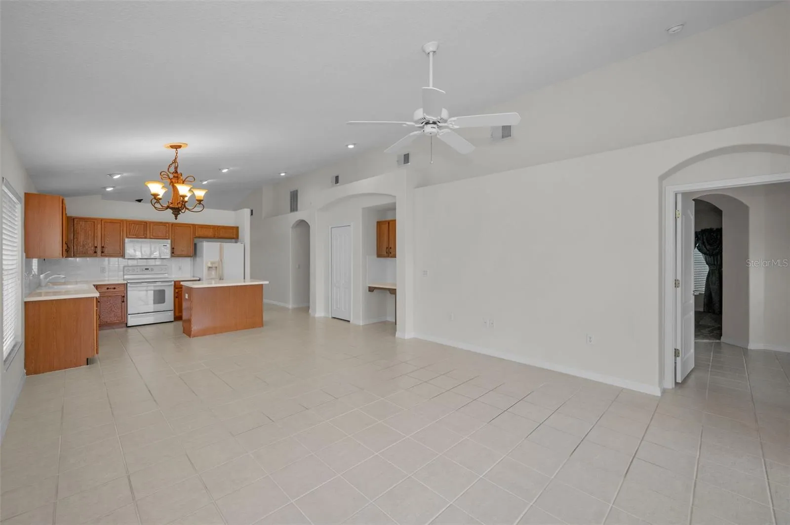 VIEW OF KITCHEN FROM FAMILY ROOM SLIDERS.