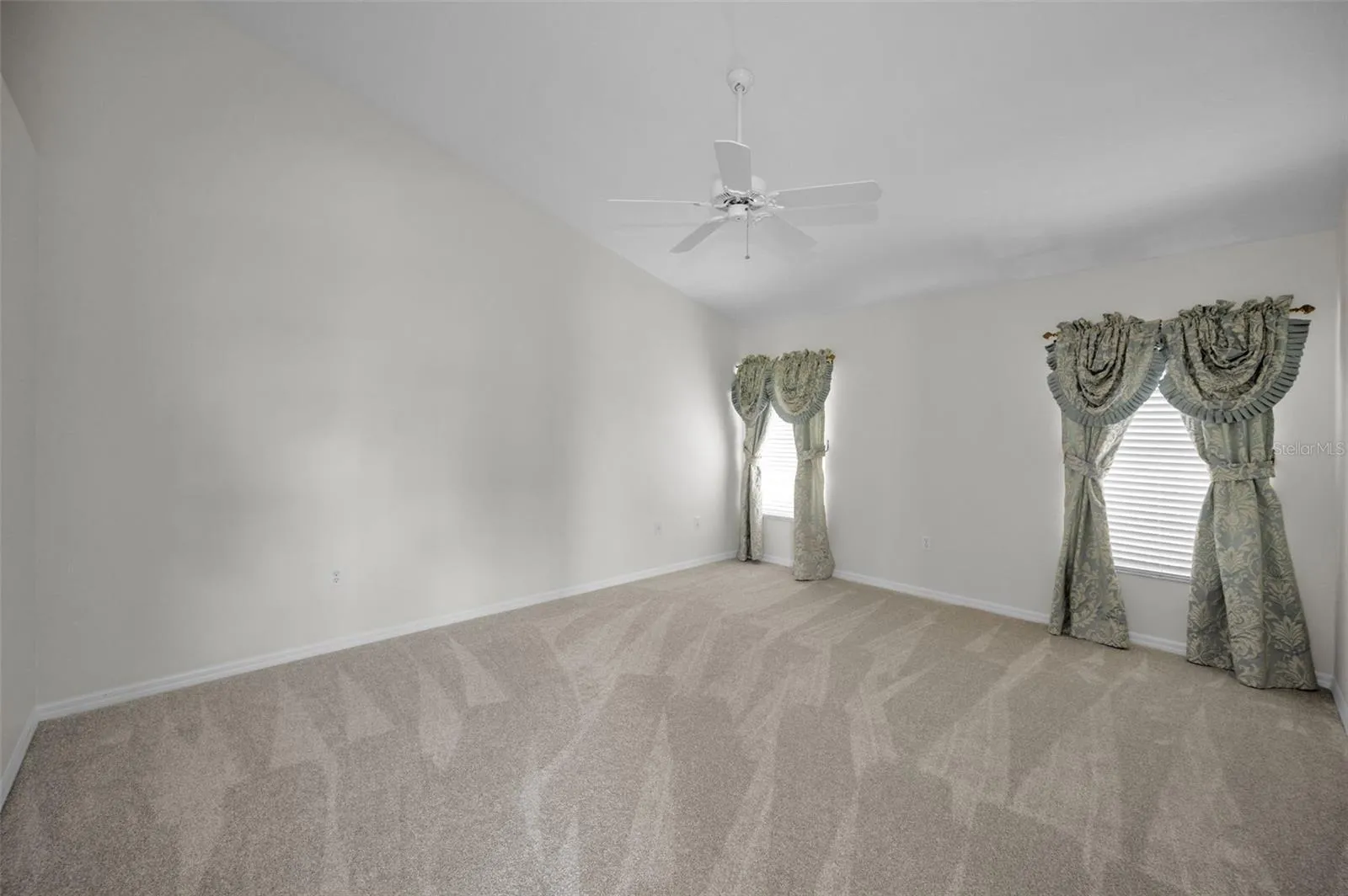 PRIMARY SUITE FRESHLY PAINTED AND NEW CARPETS.