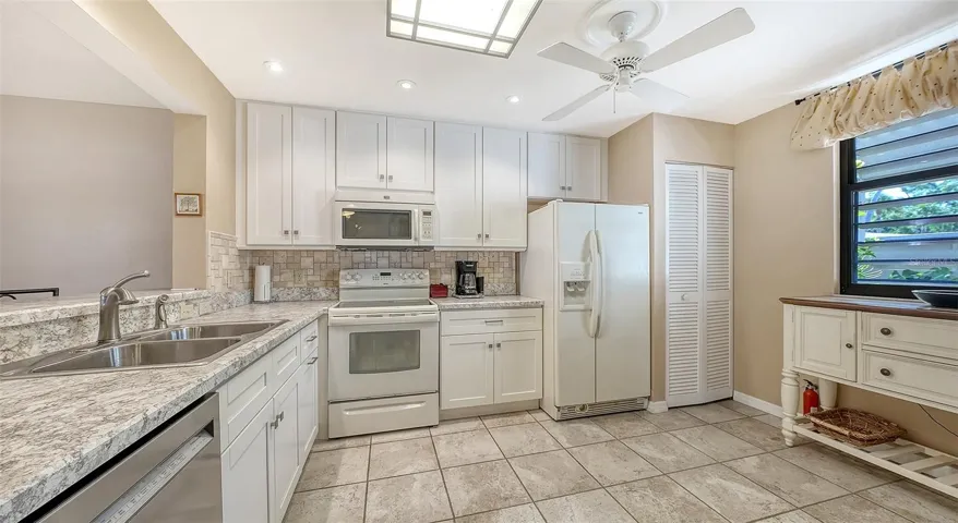 Kitchen - window is to front courtyard. Closet on right holds washer/dryer