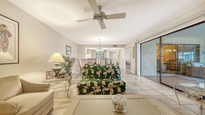 Living room with den in background on right