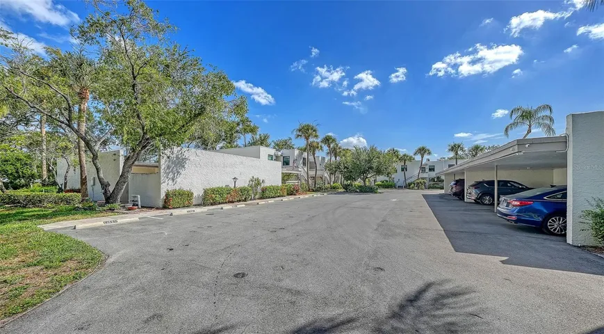 Carport garage on right residence is on left