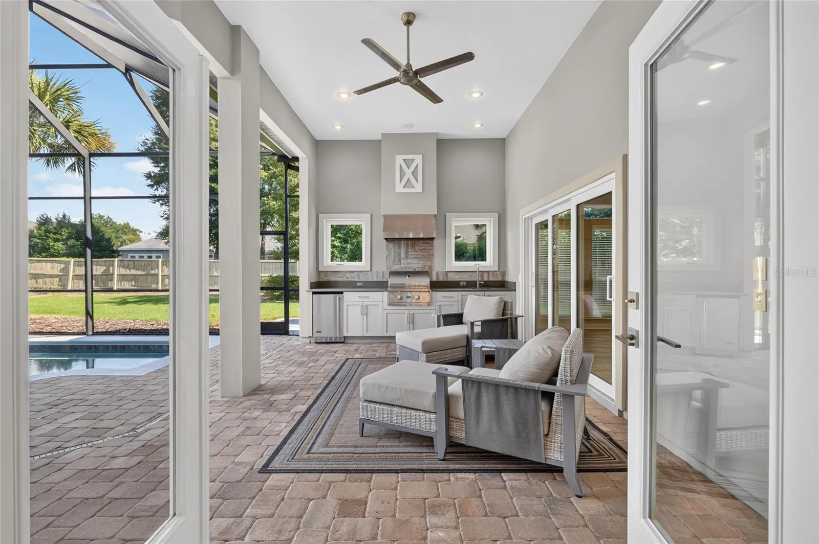 French doors from dining area to summer kitchen