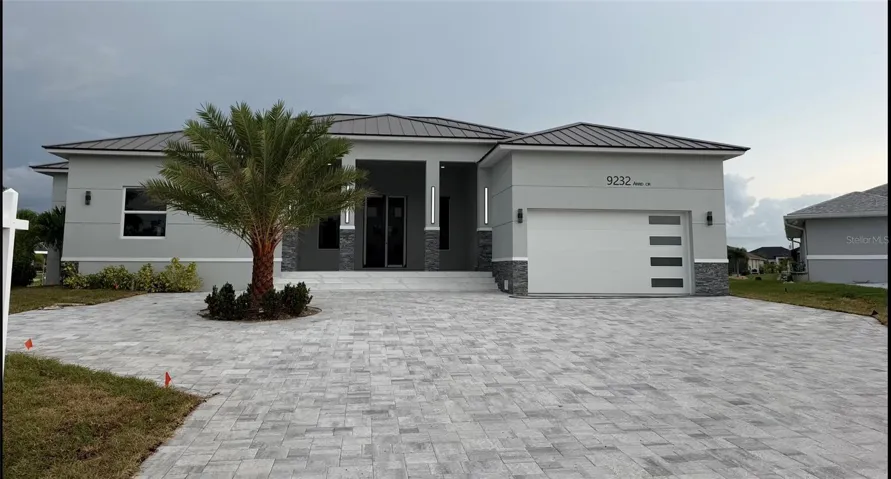 Welcome to 9232 Arrid Cir offering over 3500 sq ft Modern Waterfront Living