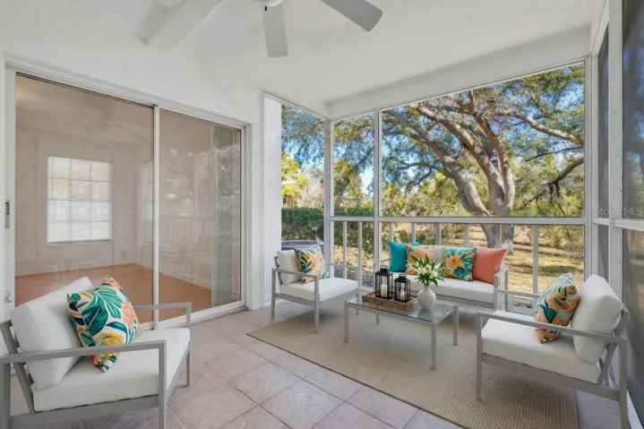 Private screened lanai with serene pond views - virtually staged