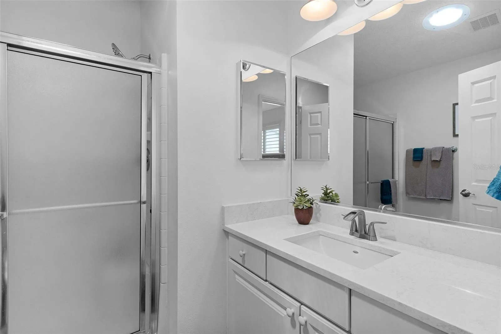 PRIMARY BATHROOM WITH QUARTZ COUNTERS
