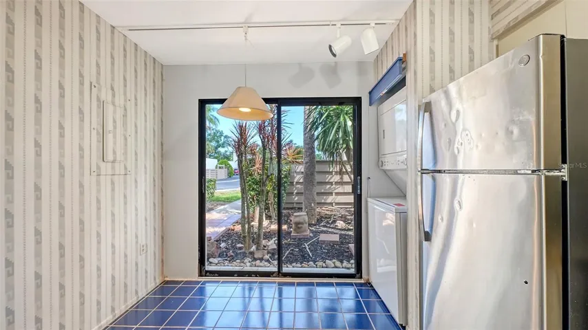 Kitchen, front courtyard and sidewalk to front door.