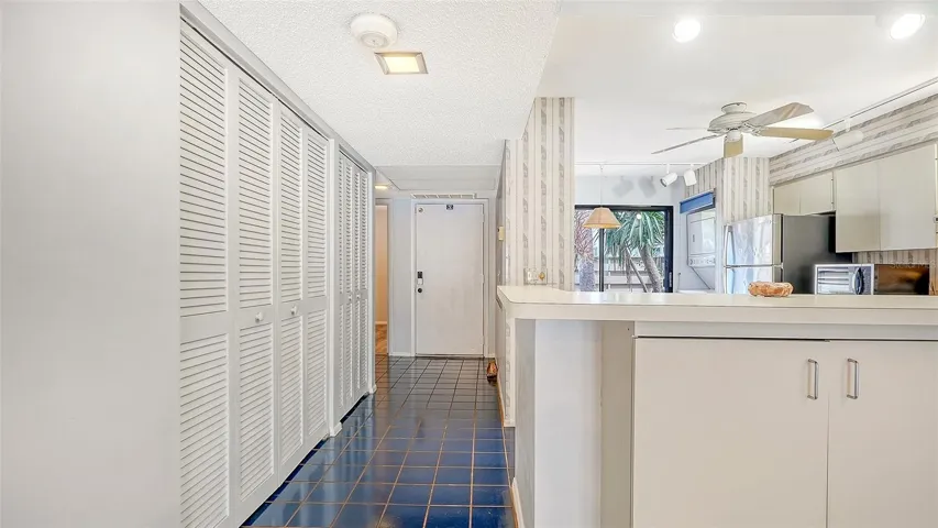 Kitchen and foyer.Large reach-in closet on left.