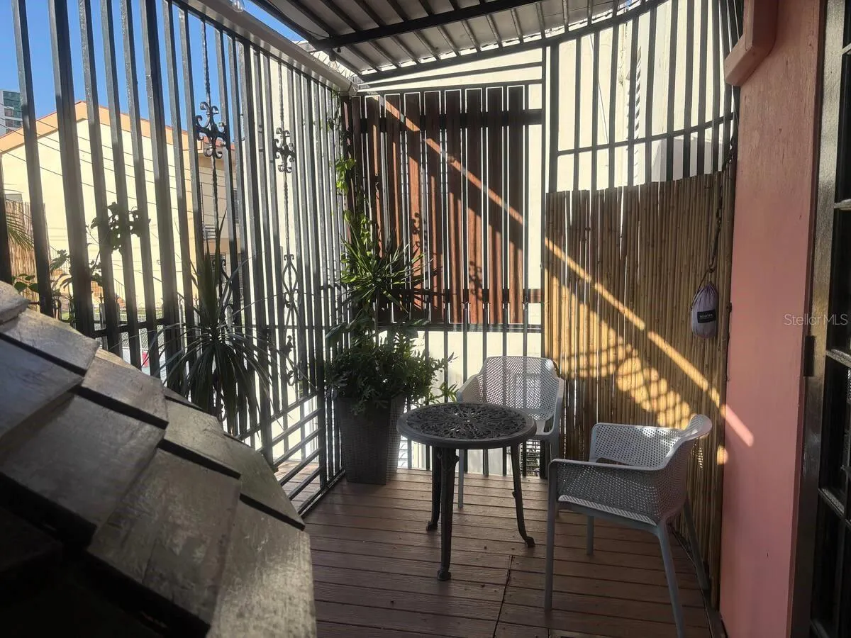 2nd floor rear deck with seating area, hammock hooks and gate to open deck area for sunning or future generator.
