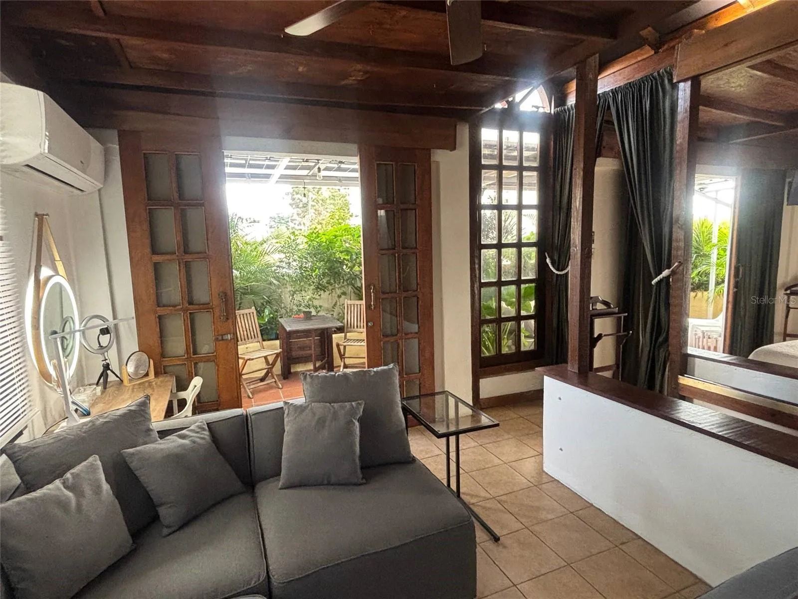 Penthouse living room looking to the outdoor dining area.