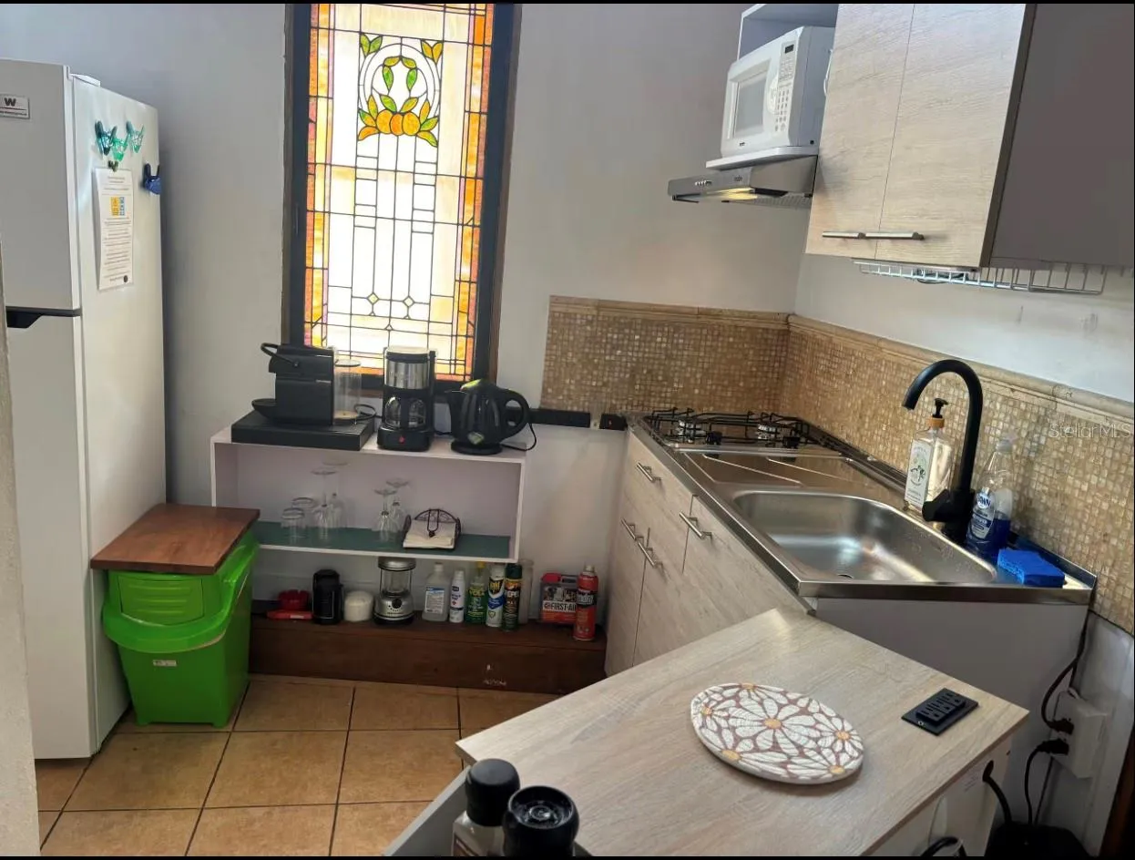 Penthouse kitchenette with moveable work counter.