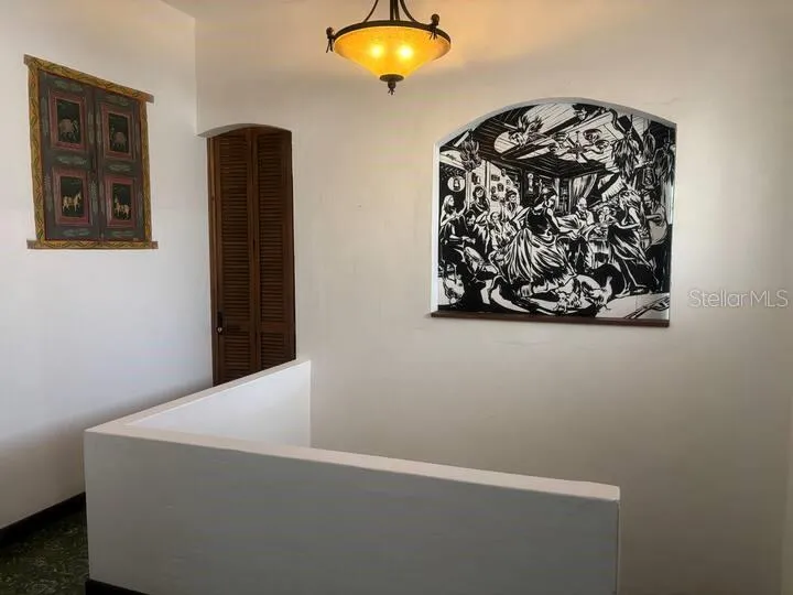 2nd Floor with arch to kitchen closed showing mural by local artist Sarah Urbain.