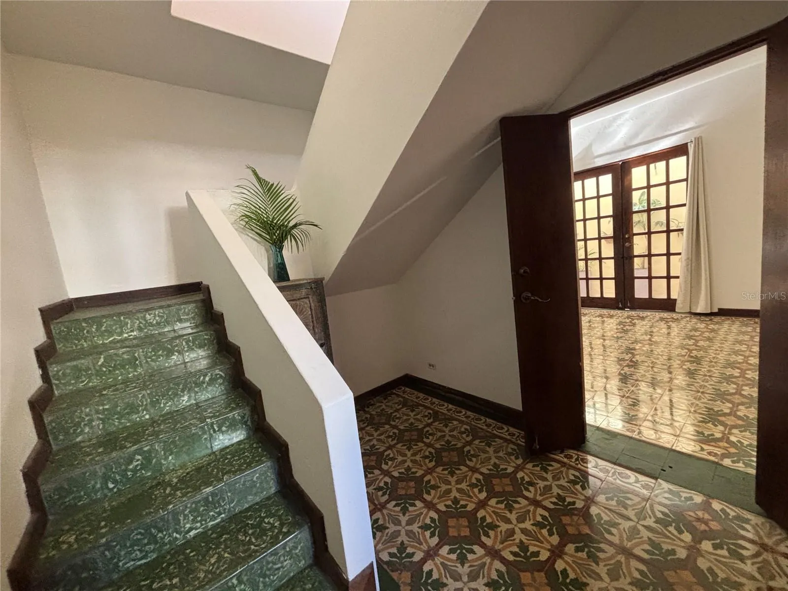 Staircase has an additional foyer with direct entrance to the family/great room on the first floor.