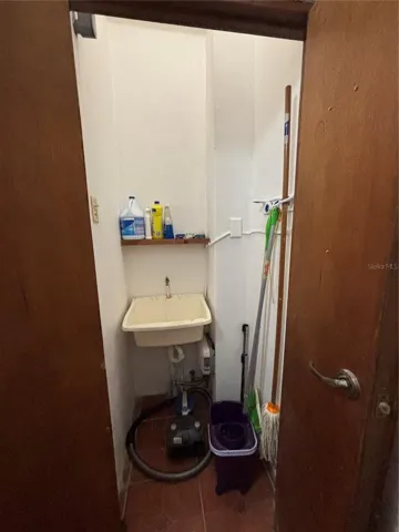 Utility sink located in 1st floor half bath/utility closet.