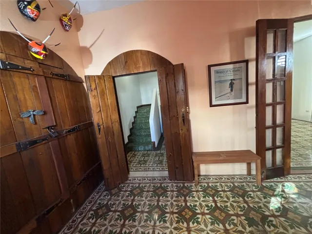 Lobby has separate entrances for the garage (left), stairway (center) and family/great room (right).