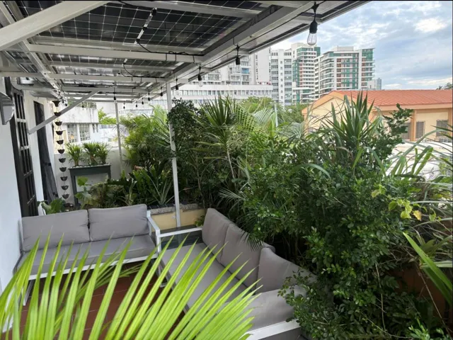 Penthouse terrace with view of Ciudadela complex in the background.