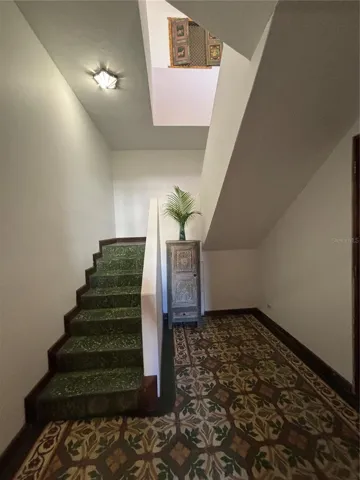 The stairway has a separate secure foyer. You can see the change from classic 1915 tiles on the first floor to the terrazzo style on the unique Art Deco staircase.