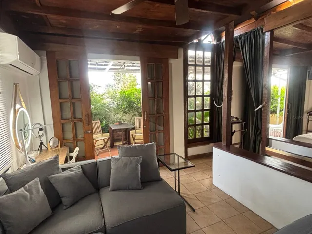 Penthouse living room looking to the outdoor dining area.