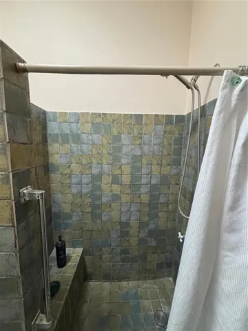 2nd floor bathroom has built-in seat in the shower.