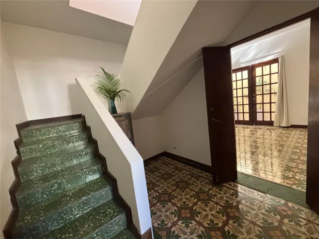 Staircase has an additional foyer with direct entrance to the family/great room on the first floor.
