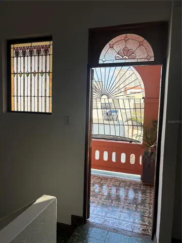 Entrance to the front balcony at the top of the stairs.
