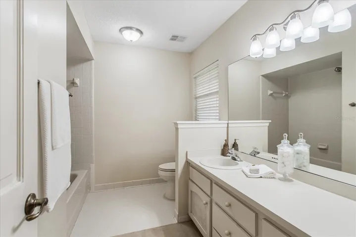 Bathroom 2, large vanity and tub with shower