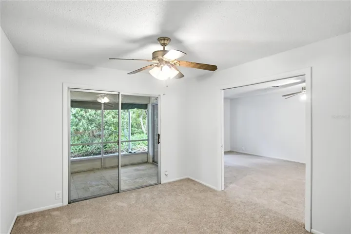 Bedroom 2 w/ slider and greenway views