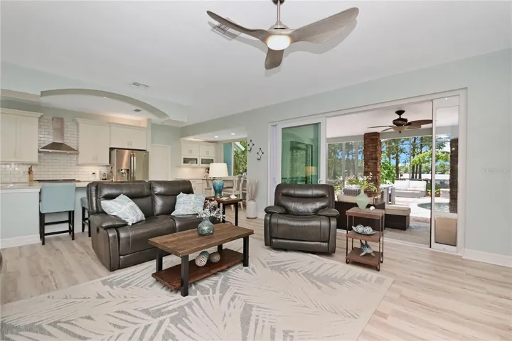 Open floor plan with triple sliders opening out to the lanai and pool.