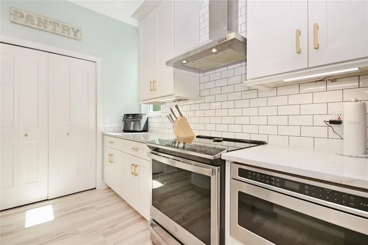 Induction range and Cafe drawer microwave.