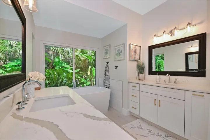 Primary bathroom with double vanities.