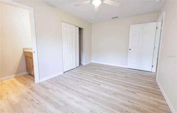 Primary bedroom with half bath