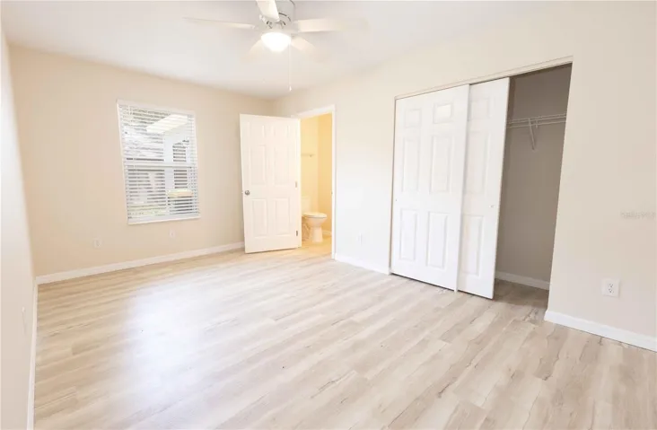 Primary bedroom with half bath