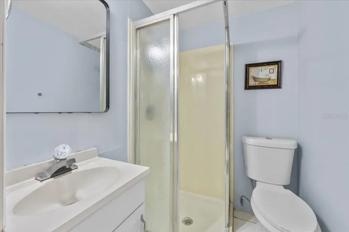 The second bathroom is located in the garage.