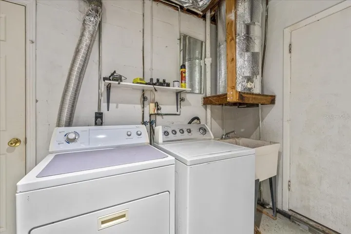 Washer & dryer unit in garage.