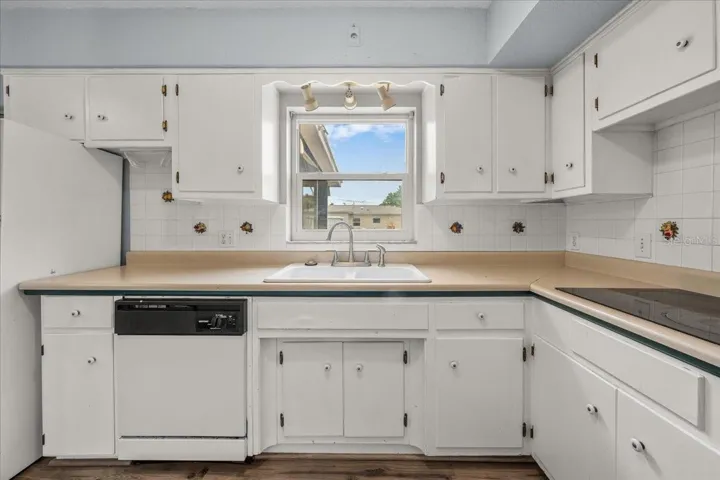 Ample cabinetry provides clean storage while the central window lets you keep an eye your little ones outback while you prepare a delicious meal.