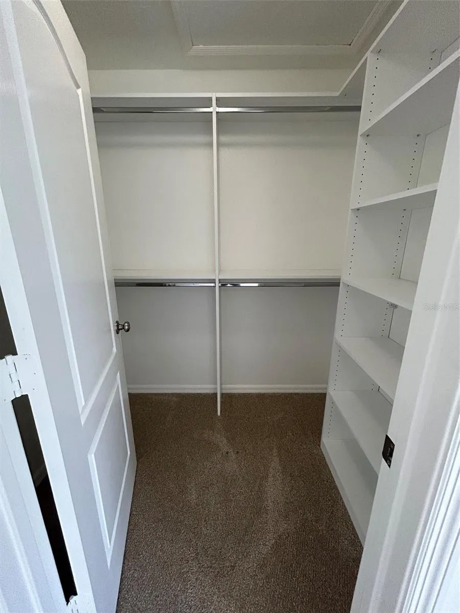 Upstairs custom walk in closet 1