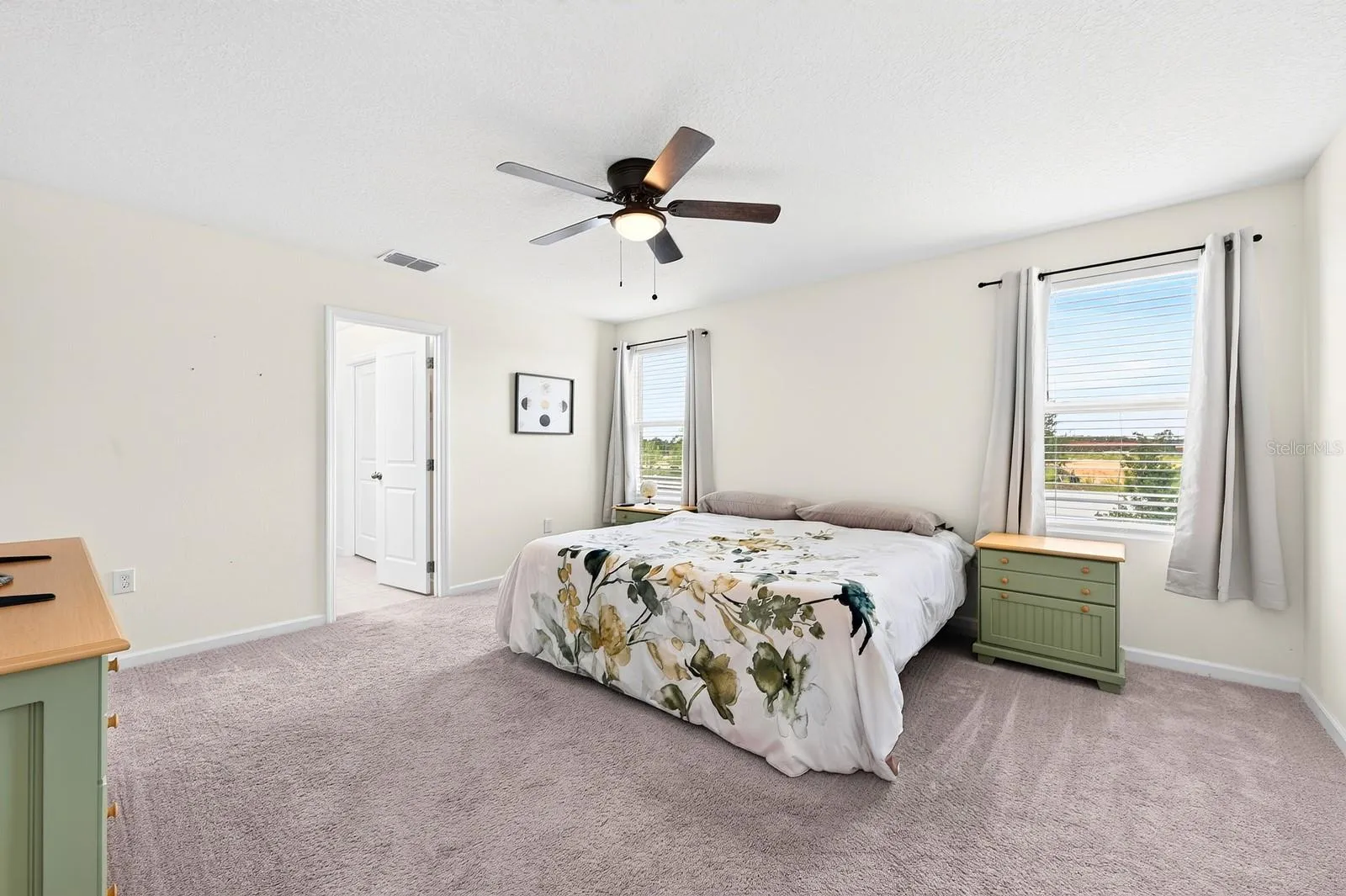 The spacious Primary Suite features a huge walk-in closet and a PRIVATE EN SUITE BATH, designed for comfort and convenience.