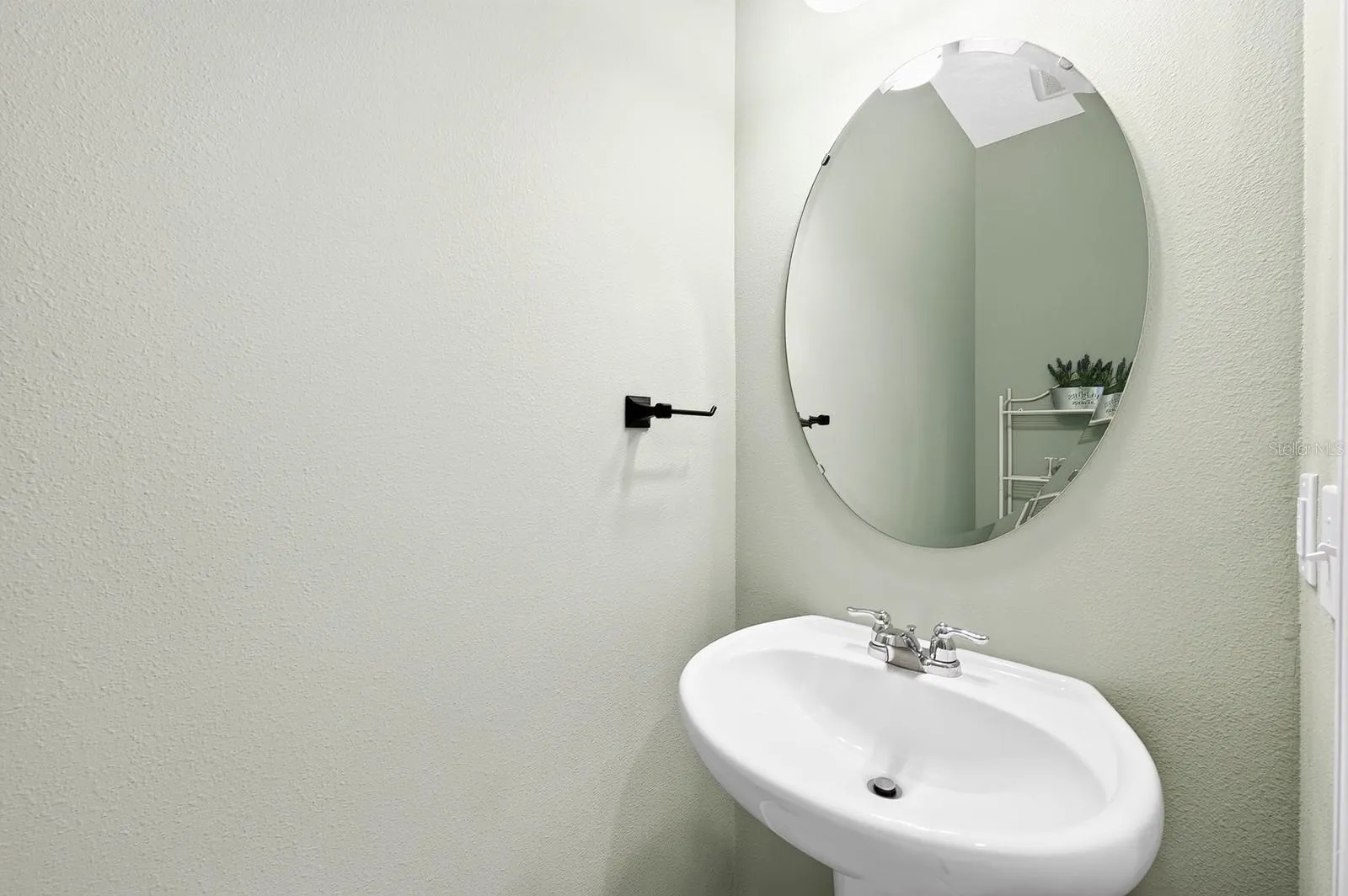 A convenient half bath completes the first floor.
