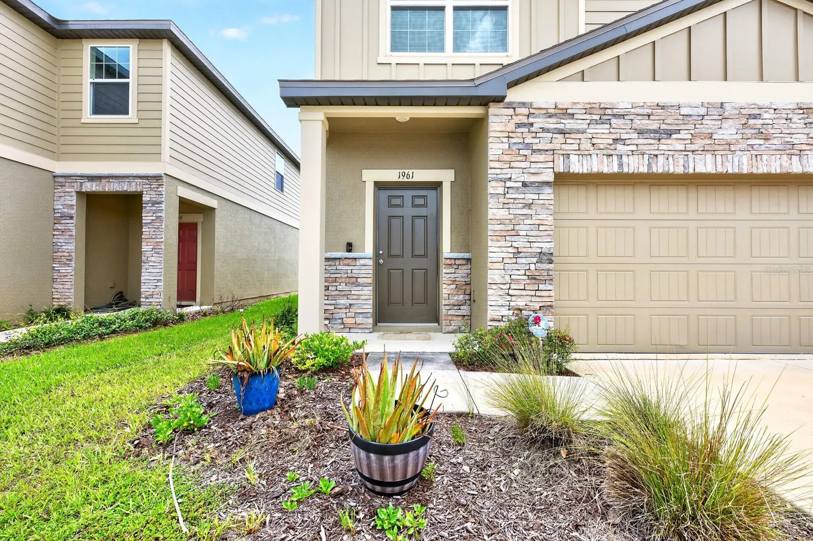 From the moment you arrive, the home's attractive curb appeal stands out with stone accents surrounding the garage and front exterior, creating a warm and welcoming first impression.