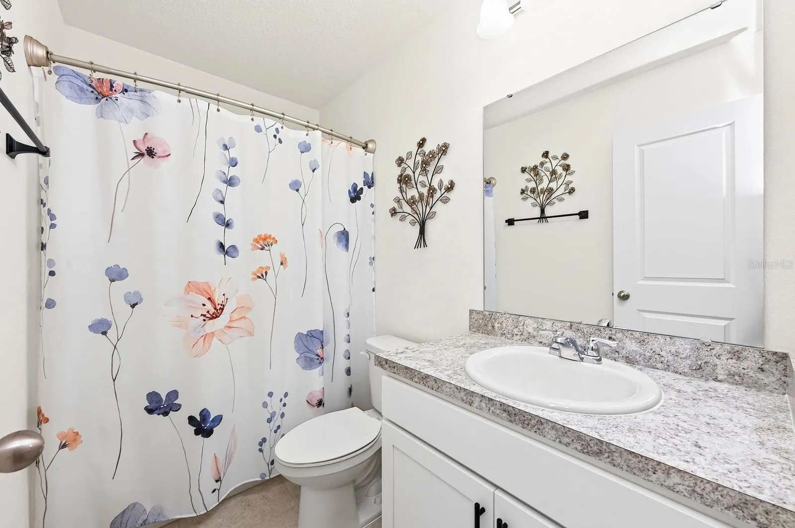 Two additional bedrooms, each with their own WALK-IN CLOSETS, share a full Bathroom.