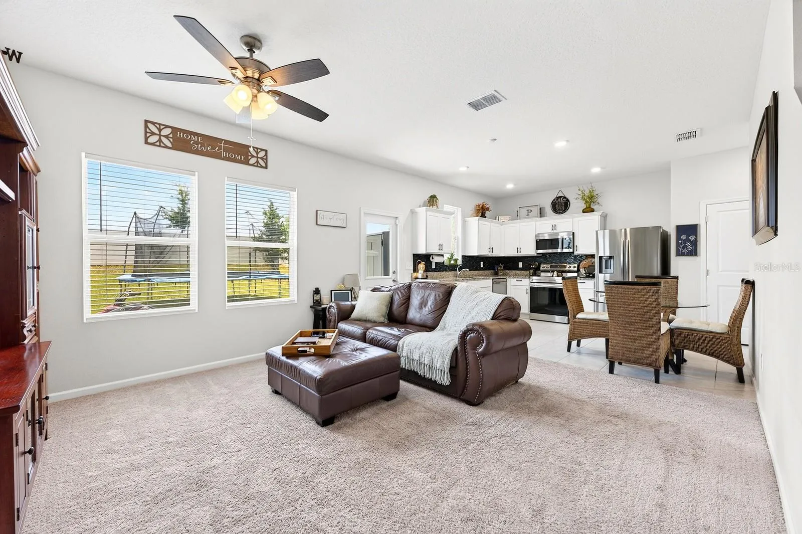 Inside, the thoughtfully designed OPEN-CONCEPT FLOOR PLAN seamlessly connects the Living Room and Kitchen, making it ideal for both everyday living and entertaining.