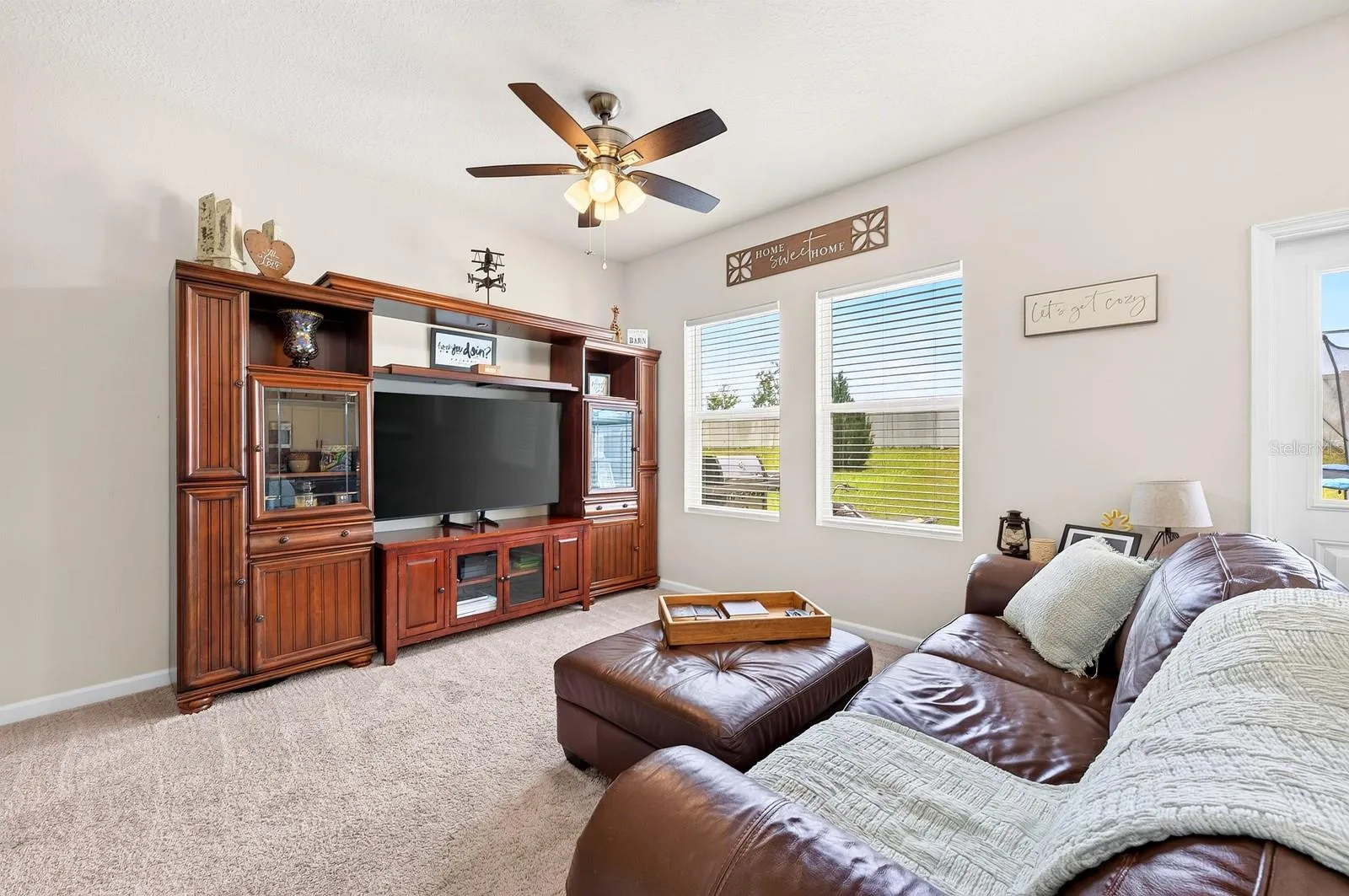 Conveniently adjacent to the Kitchen, the expansive Living Room invites connection and comfort.