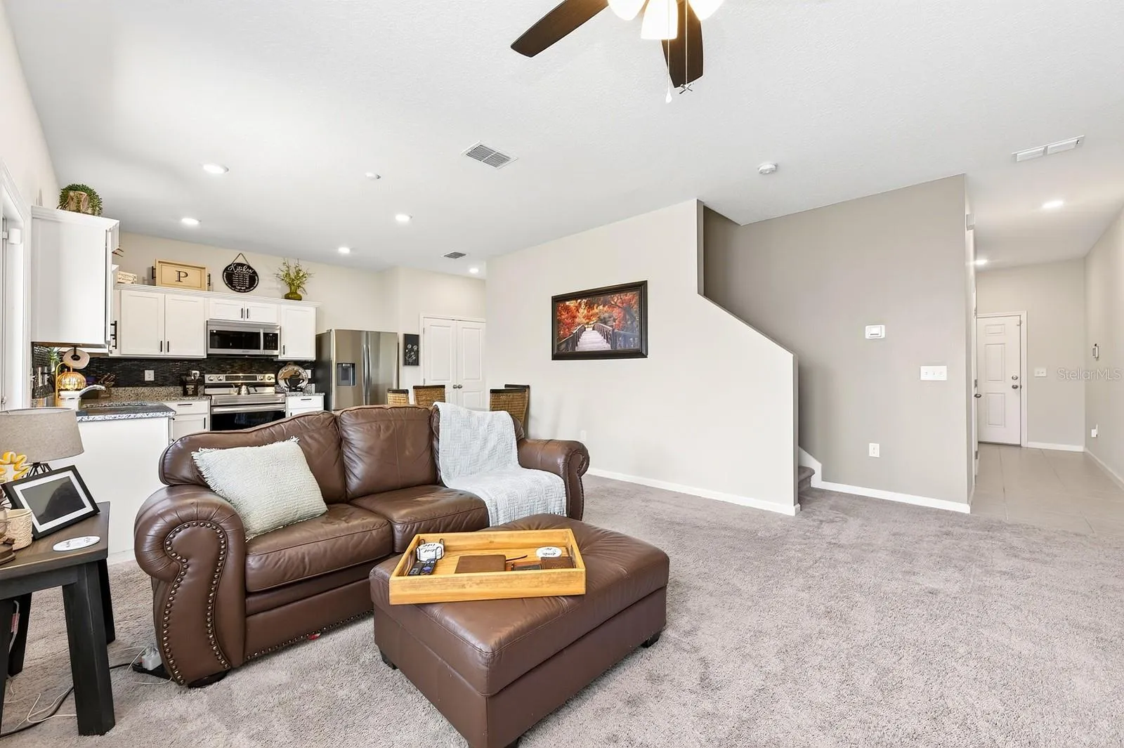 Inside, the thoughtfully designed OPEN-CONCEPT FLOOR PLAN seamlessly connects the Living Room and Kitchen, making it ideal for both everyday living and entertaining.