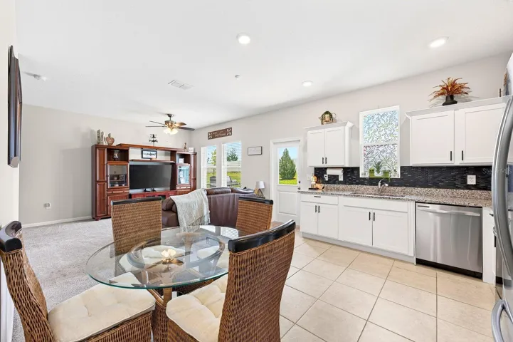 A SPACIOUS EAT-IN DINING AREA is perfect for casual family meals or gathering with friends.