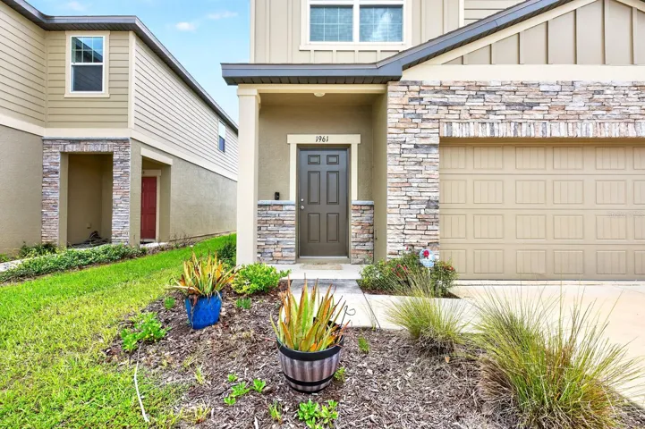 From the moment you arrive, the home's attractive curb appeal stands out with stone accents surrounding the garage and front exterior, creating a warm and welcoming first impression.