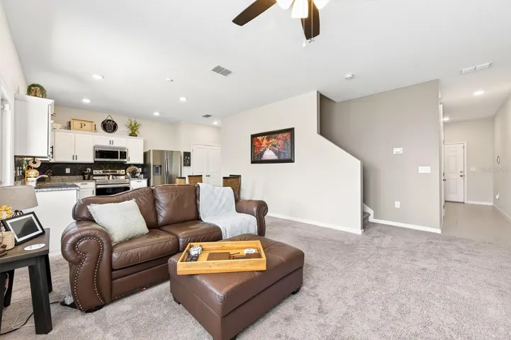 Inside, the thoughtfully designed OPEN-CONCEPT FLOOR PLAN seamlessly connects the Living Room and Kitchen, making it ideal for both everyday living and entertaining.
