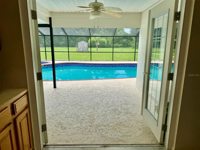 Kitchen entry/exit to enclosed pool and spa