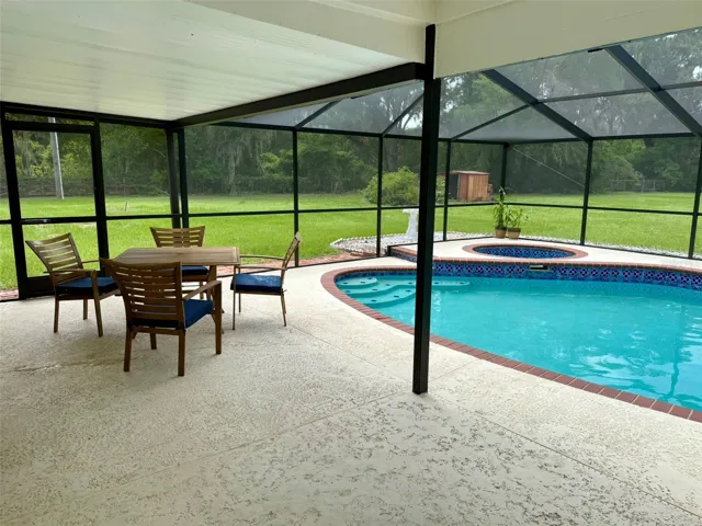 Enclosed pool and spa, covered seating area
