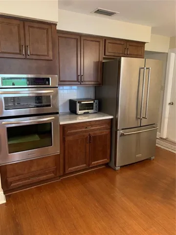 side by side refrigerator with marble countertops