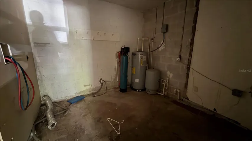 Laundry Area with Hot Water Heater